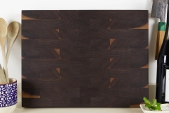 Rogue Wood walnut end-grain cutting board on a kitchen countertop